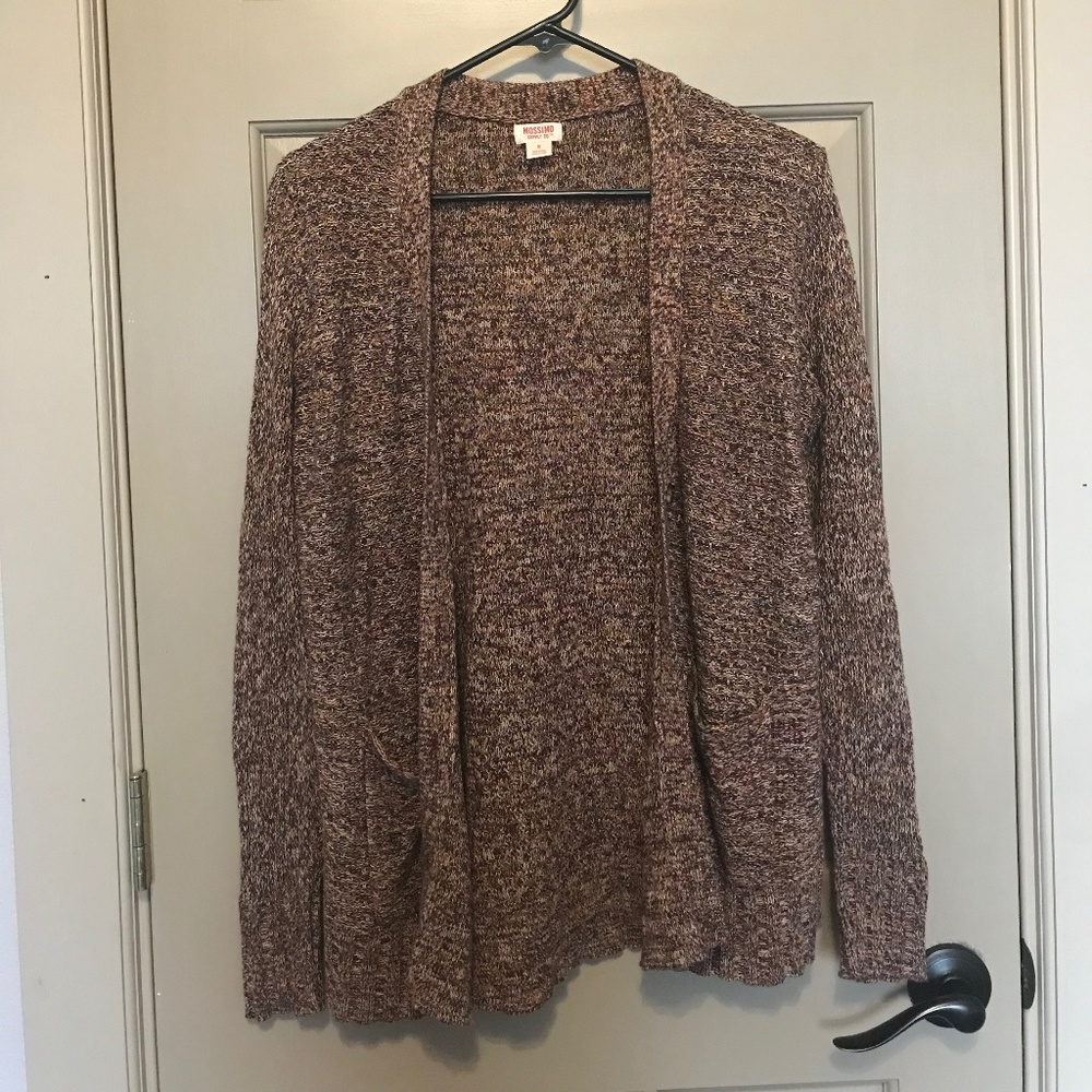 Multi colored button up sweater with pockets.